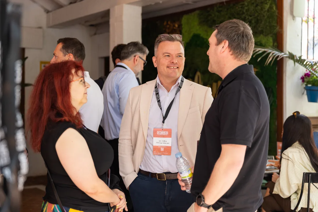Leo Judkins in conversation with members at a networking event