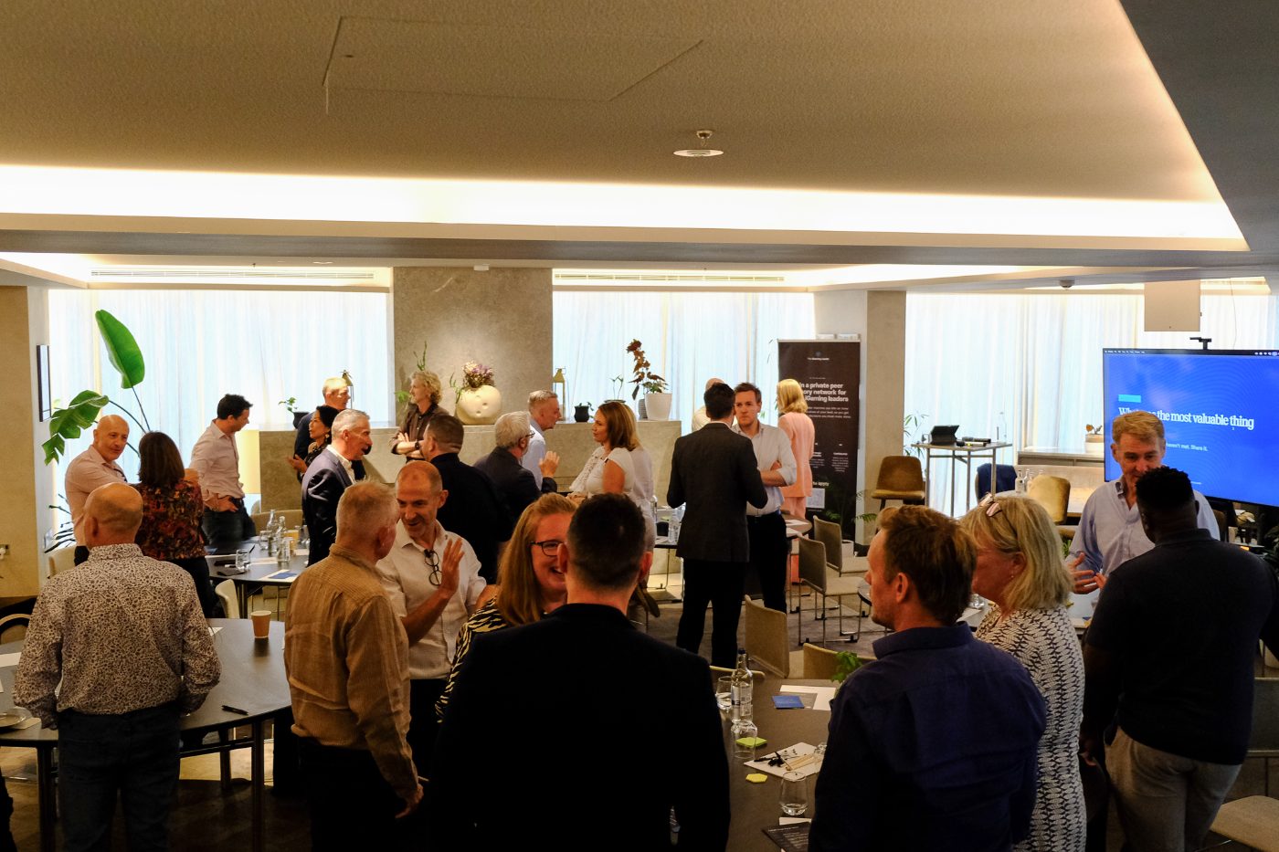 Attendees networking after the formal sessions