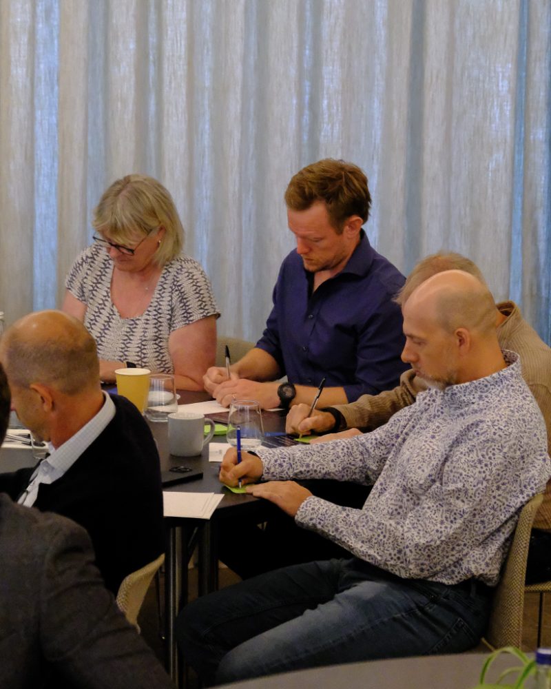 Attendees working through the room's exercises